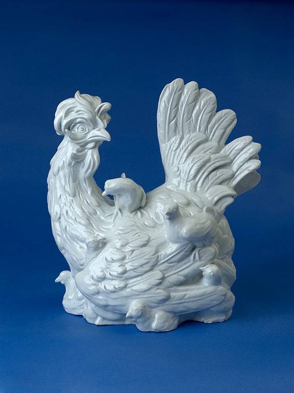 A Meissen white porcelain model of a hen with her chicks